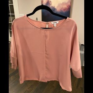 Express dusty pink short sleeved blouse with slight split in back size medium